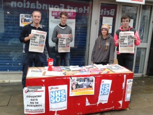 Party members selling 'The Socialist' newspaper - the Socialist Voice of workers and youth